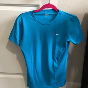 Blue Nike shirt.